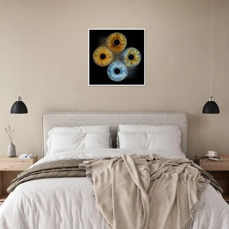 Framed iris poster above a bed in a cozy bedroom setting