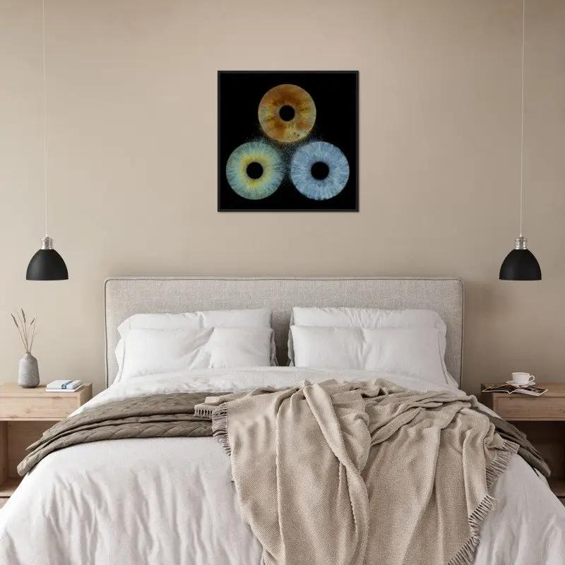Trio iris poster framed in black above bed in modern bedroom